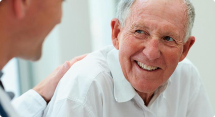 An elderly talking to a pharmacist